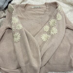 Chic V-Neck Sweater with Floral Details